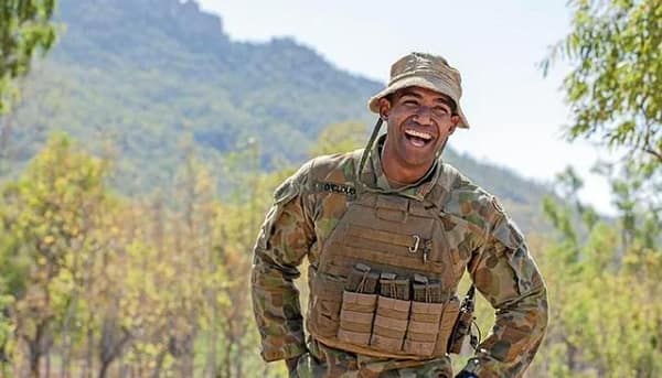 Man in military outfit smiling