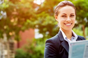 Woman holding cover letter.