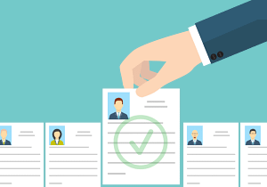 cartoon image of resume being picked out from a group of other resumes